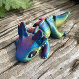 3D printed mini axolotl sea creature in dark rainbow colourway Pilola