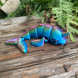 3D printed mini narwhal sea creature in dark rainbow colourway Pilola
