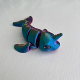 3D printed mini narwhal sea creature in red blue green colourway Pilola