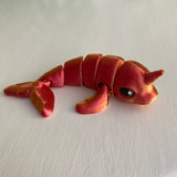 3D printed mini narwhal sea creature in red gold colourway Pilola