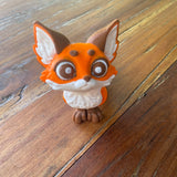 Cute 3d printed Red Fox. Printed by Pilola. Full face shot on a wooden background